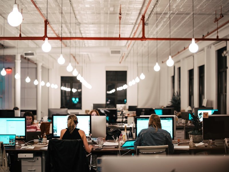 Modern open-plan office with monitors — cloud accounting software setup and migration